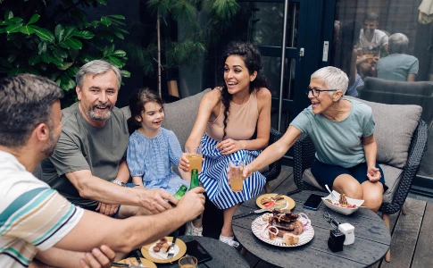 family gathered around in backyard